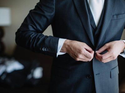 diverse-young-man-getting-ready-and-putting-on-his-suit-and-tie-formal-evening-wear-business-attire_t20_koe3aE.jpg